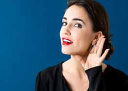 Active listening, woman with hand to ear